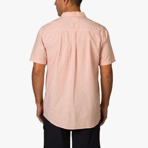 Man wearing a light pink Collins Ss Woven Shirt showing the back, casual beach-inspired men’s apparel