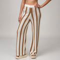 Front view of Mika Sweater Pant in brown and white stripes with soft cushioned beach sandals for women