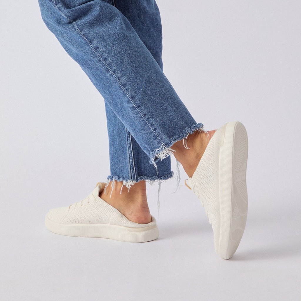 Reef Neptune women's cream knit sneaker facing left, showcasing lightweight, cushioned comfort and anatomical arch support.