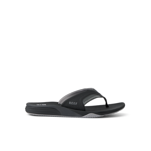 Cushion Fanning black flip flop sandal facing right with arch support and soft cushioning, designed for beach comfort.