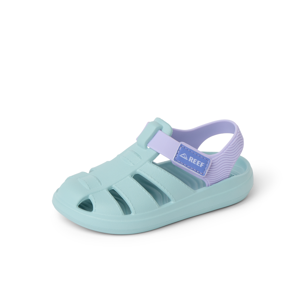 Little Totally Beachin sandal facing left, blue and lavender, close-up of the front and side with comfort features visible