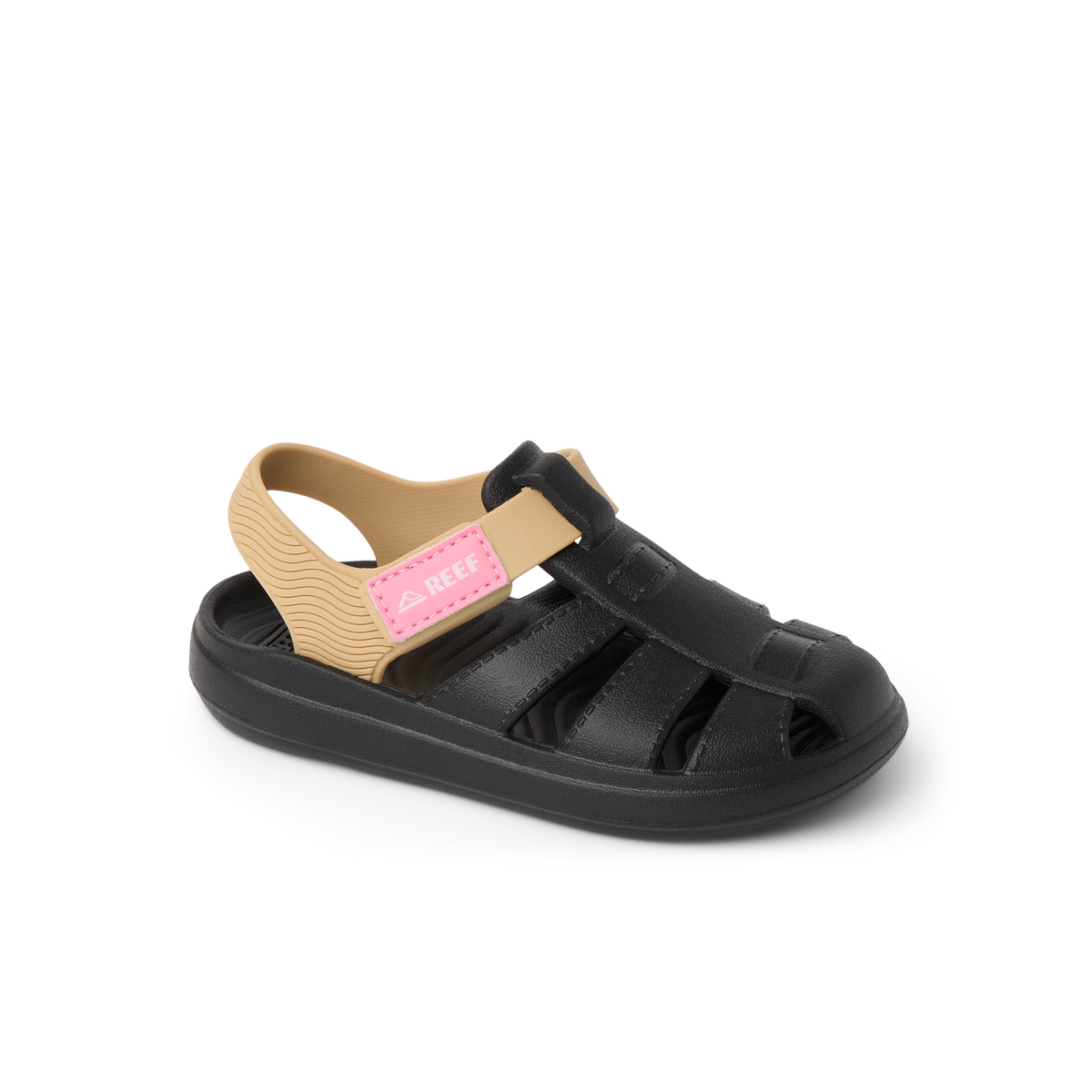Little Totally Beachin girls sandal facing left, black and tan with arch support and soft cushioning for beach comfort.