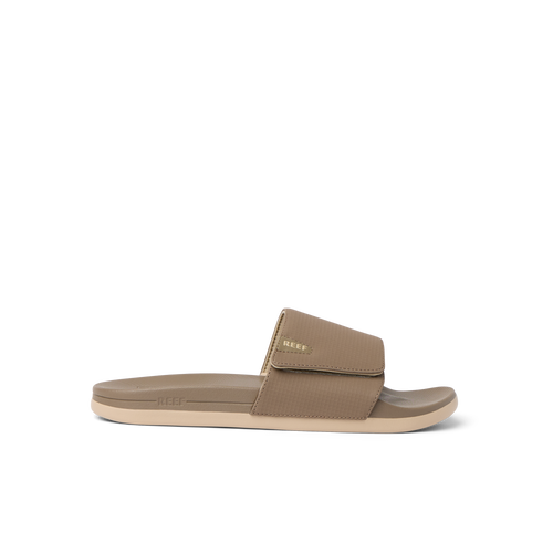 Side view of tan Cshn Phantom Slide with arch support and soft cushioning designed for beach comfort and everyday wear.