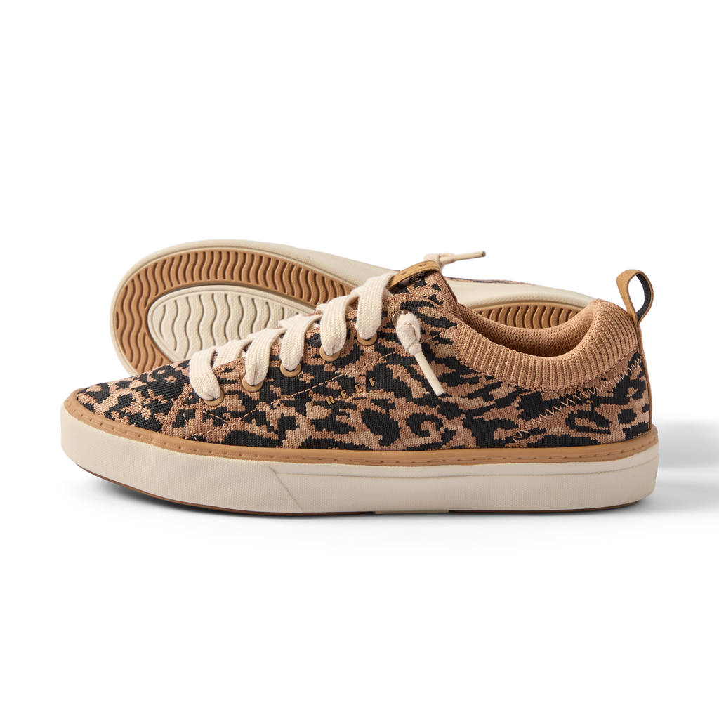 Side view of women's Lay Day Lite sneaker in leopard pattern, showing comfort-focused design and durable sole.