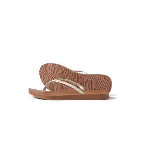 Cushion Slim women's flip flops facing right, side and sole view, featuring surf-inspired cushioning and arch support.