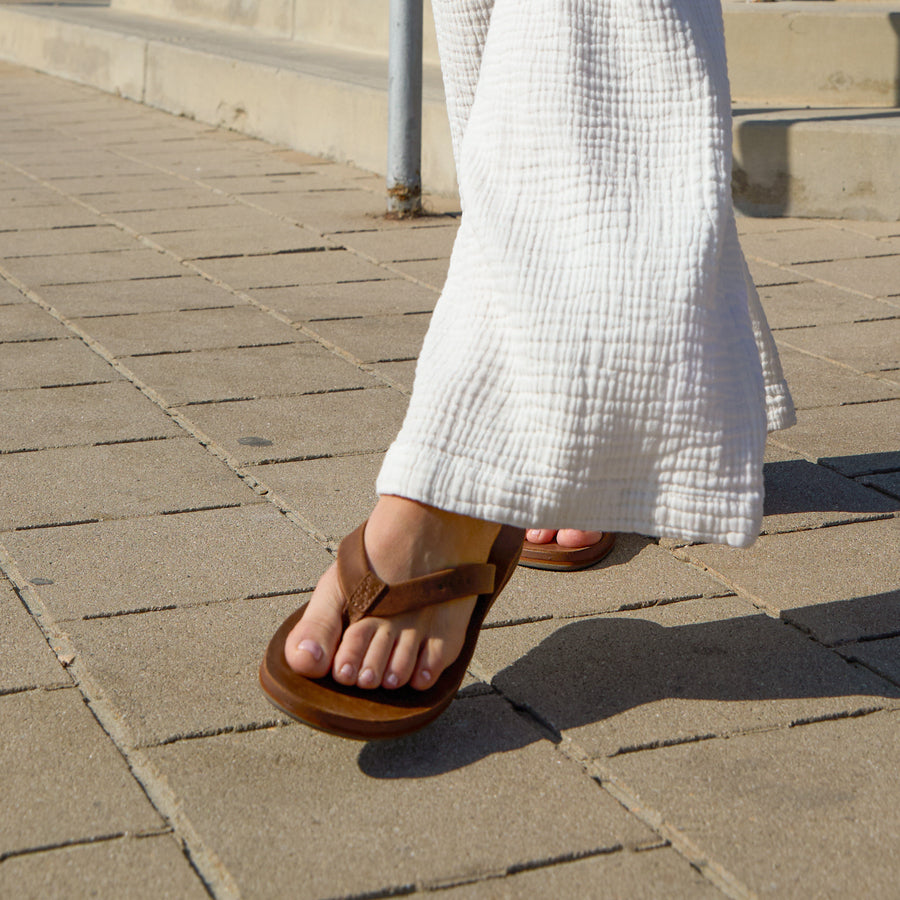 Ojai Classic Slim sandal in dark brown, right foot angled forward, showing soft cushioning and arch support design.
